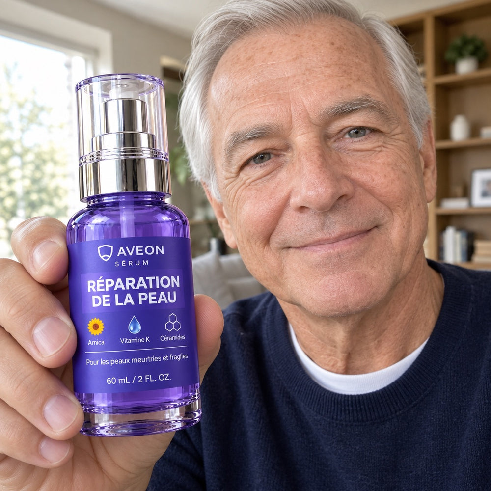 Homme aux cheveux gris en pull bleu marine tenant le sérum Aveon